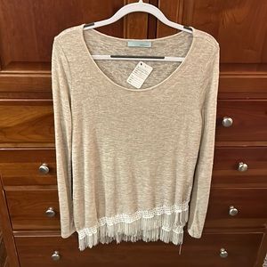 NWT beautiful lightweight beige cream sweater with white fringed bottom.
